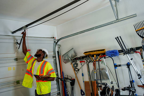 Professional Garage Door Panel Replacement technician working in Caledonia County County, VT